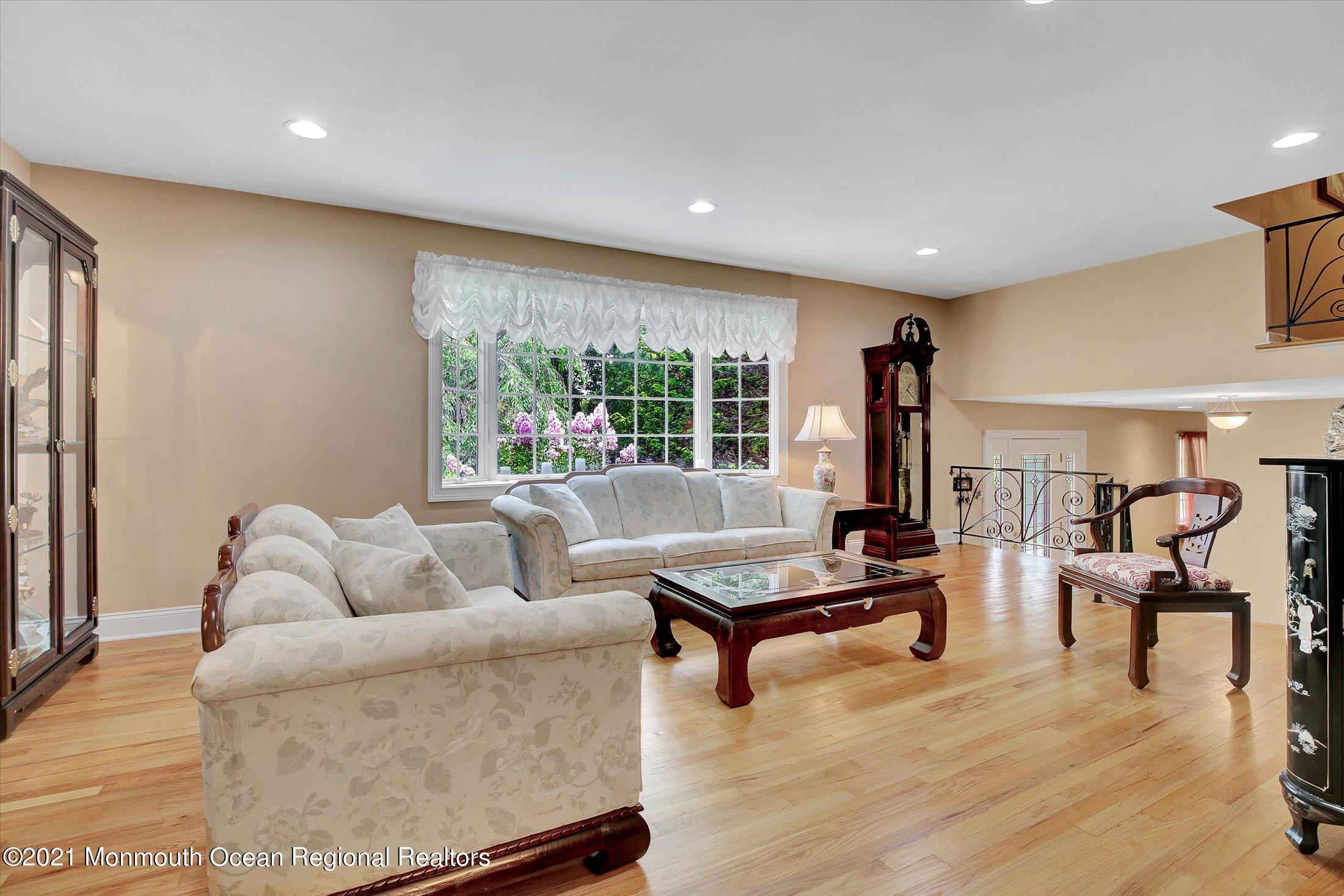 76 Swimming River Road Lincroft, NJ 07738 - Photo 11 of 50 a living room with furniture and a table