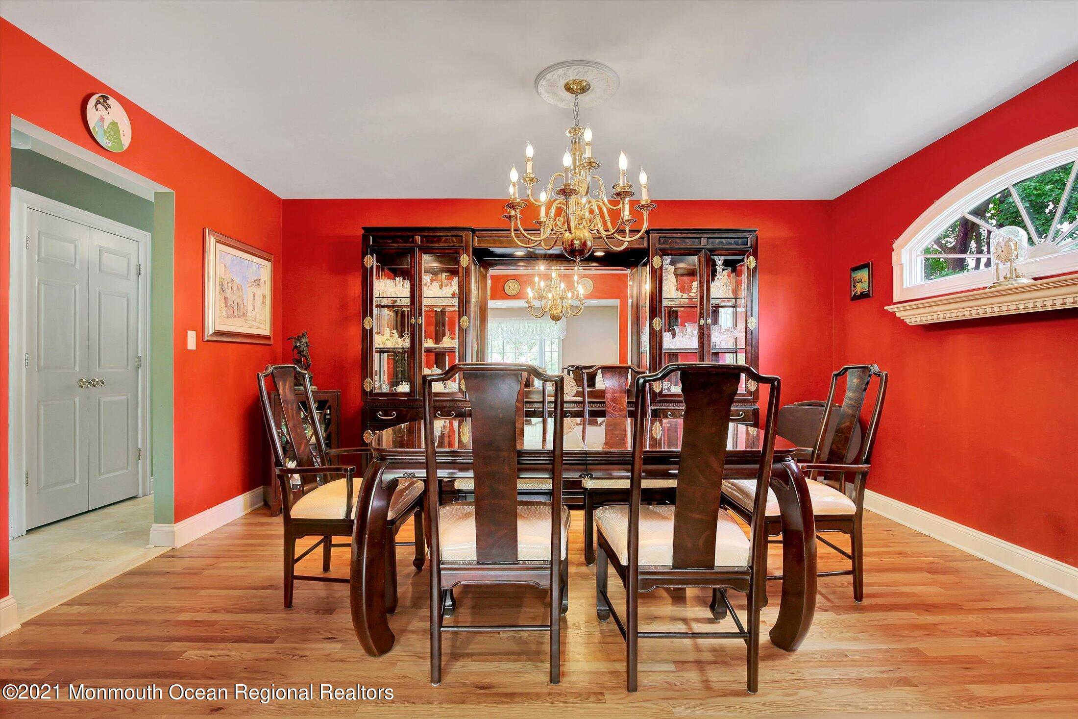 76 Swimming River Road Lincroft, NJ 07738 - Photo 12 of 50 a view of a dining room with furniture and chandelier