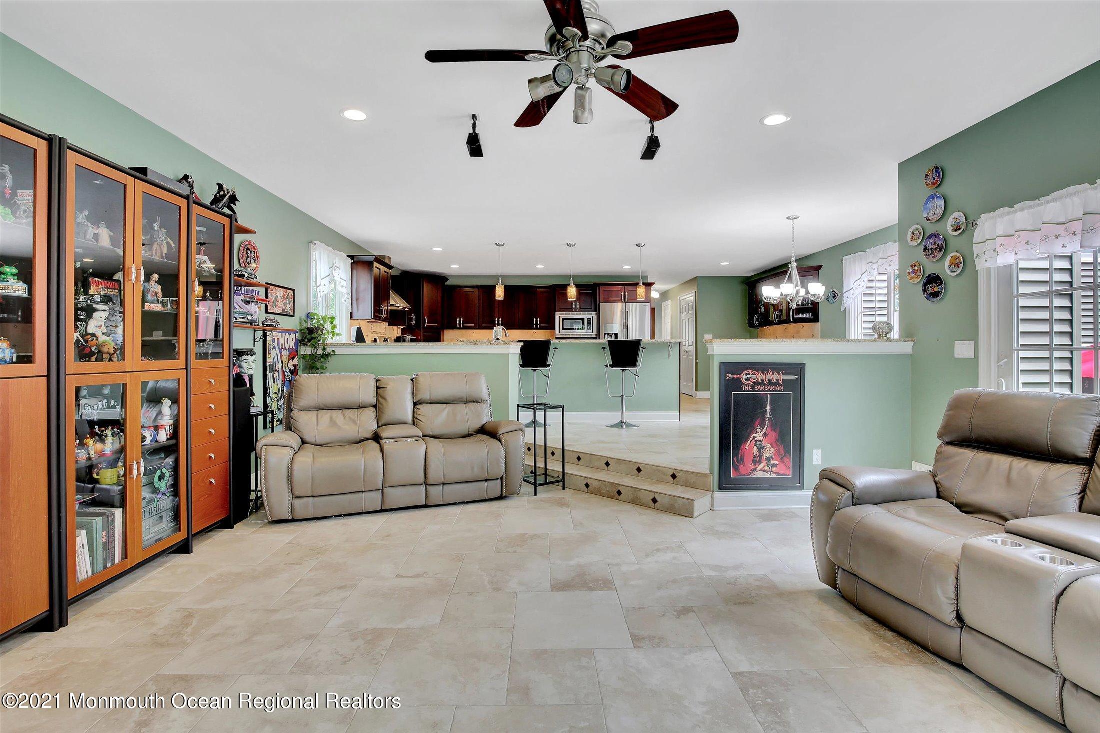76 Swimming River Road Lincroft, NJ 07738 - Photo 25 of 50 a living room with furniture and a fireplace
