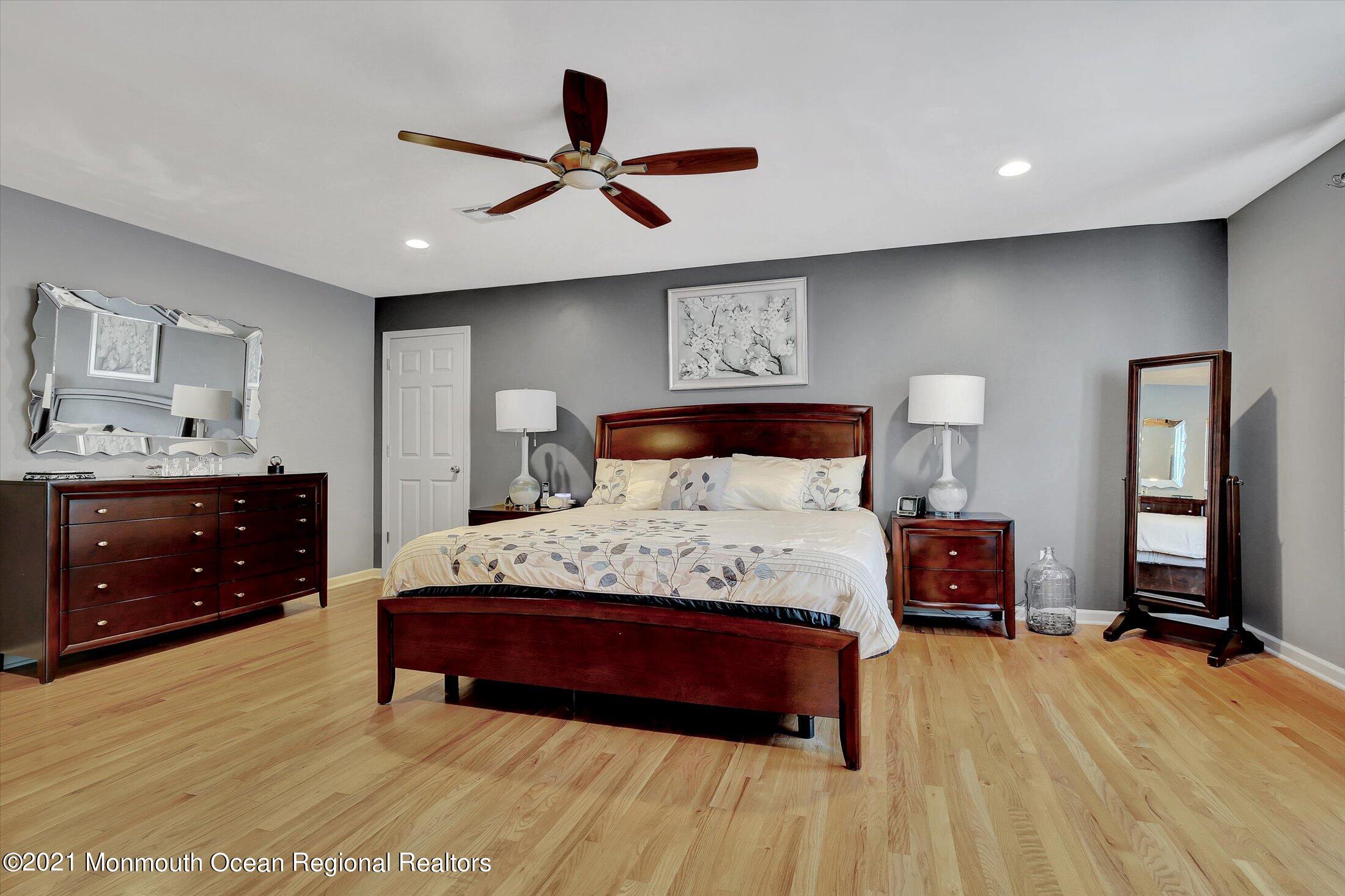 76 Swimming River Road Lincroft, NJ 07738 - Photo 28 of 50 a bedroom with a bed and a dresser
