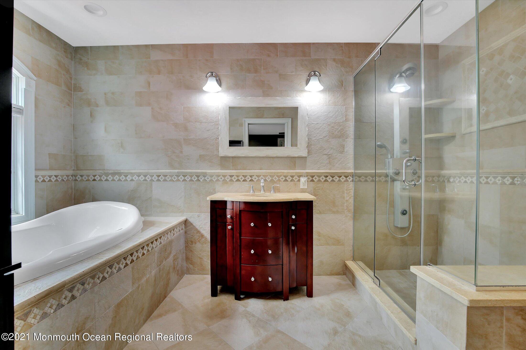 76 Swimming River Road Lincroft, NJ 07738 - Photo 30 of 50 a bathroom with a sink a toilet and shower