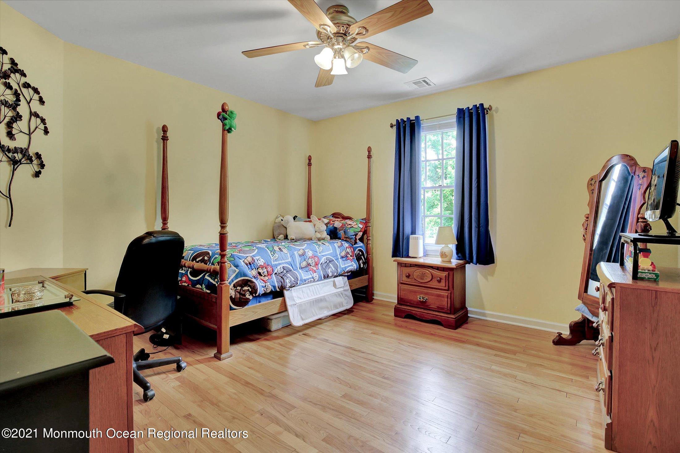 76 Swimming River Road Lincroft, NJ 07738 - Photo 32 of 50 a bedroom with furniture and a window