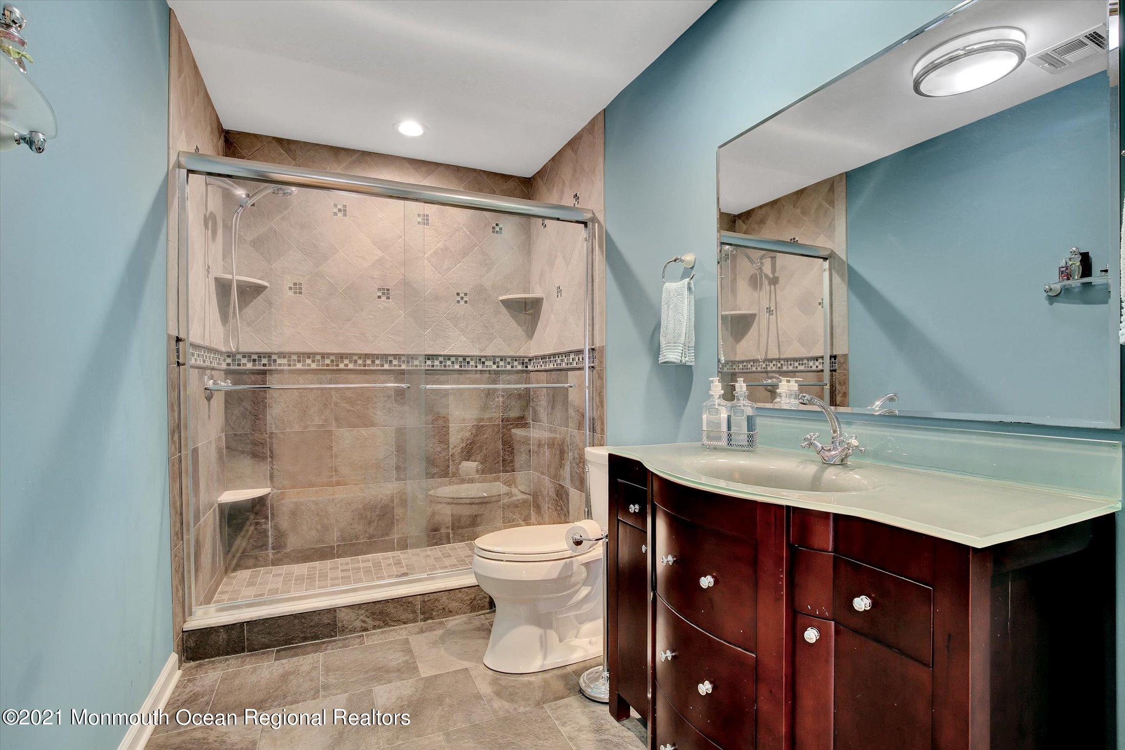 76 Swimming River Road Lincroft, NJ 07738 - Photo 33 of 50 a bathroom with a sink vanity granite toilet and shower