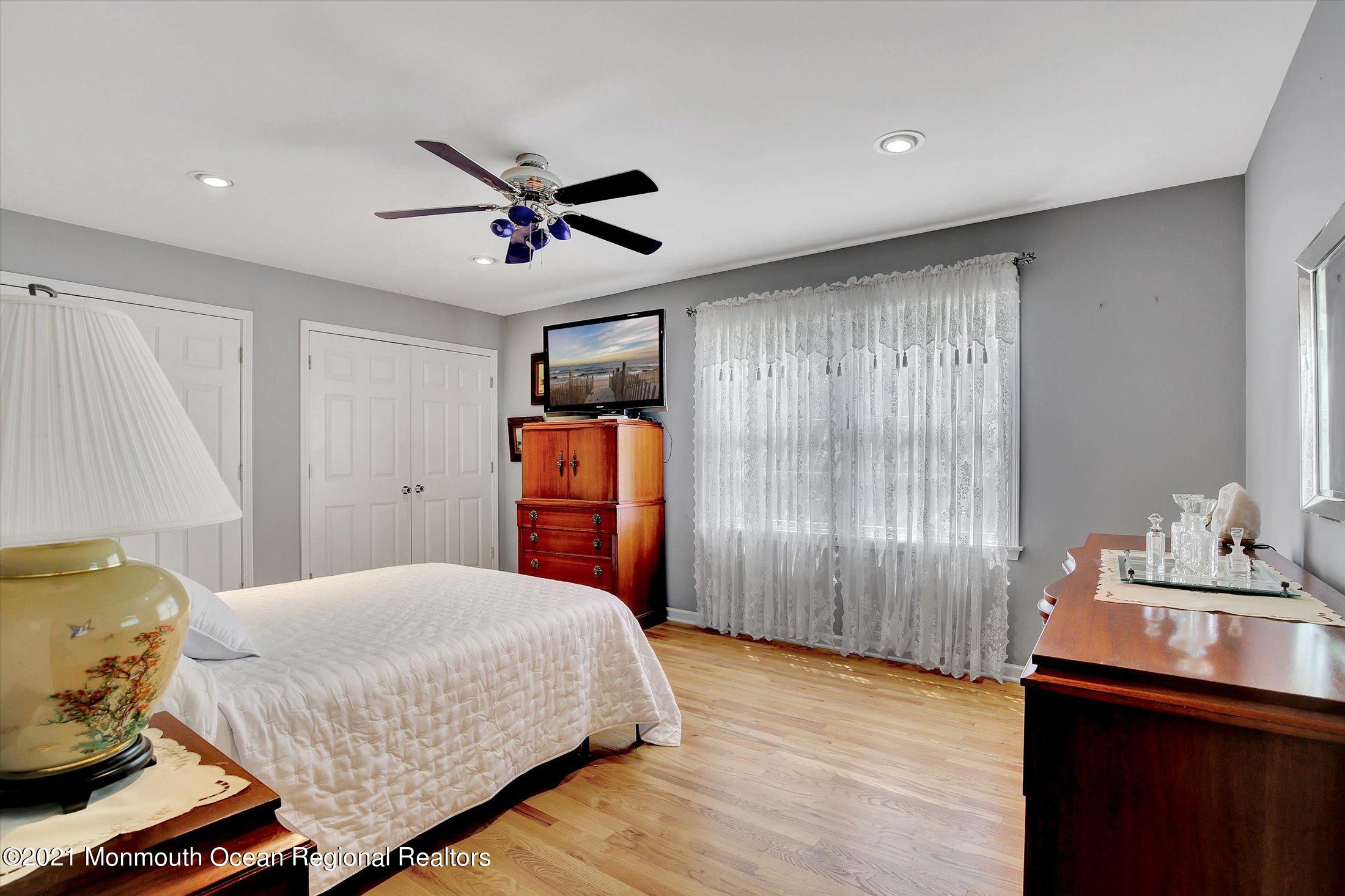76 Swimming River Road Lincroft, NJ 07738 - Photo 34 of 50 a bedroom with a bed and a dresser