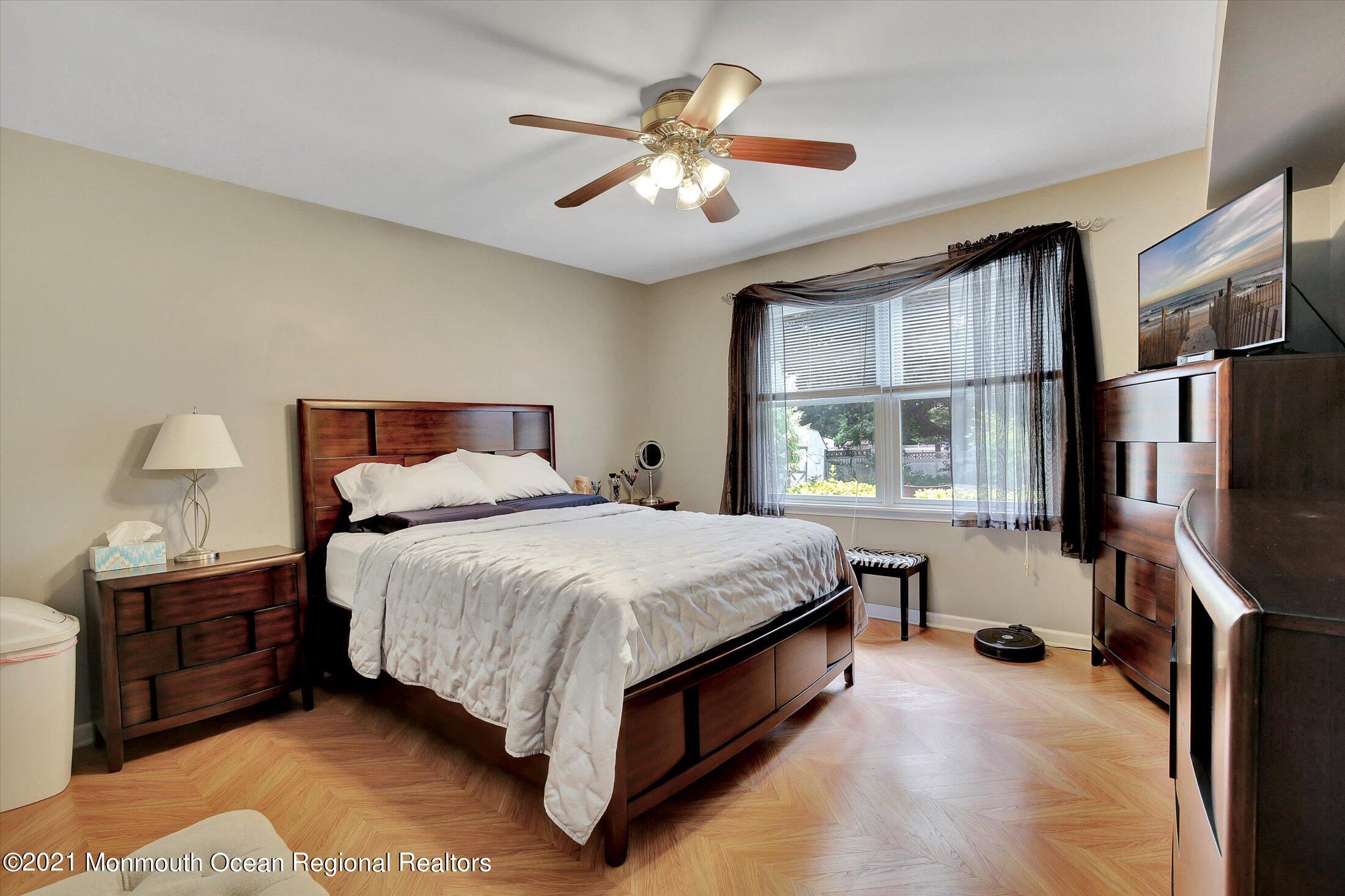 76 Swimming River Road Lincroft, NJ 07738 - Photo 42 of 50 a spacious bedroom with a bed and a window