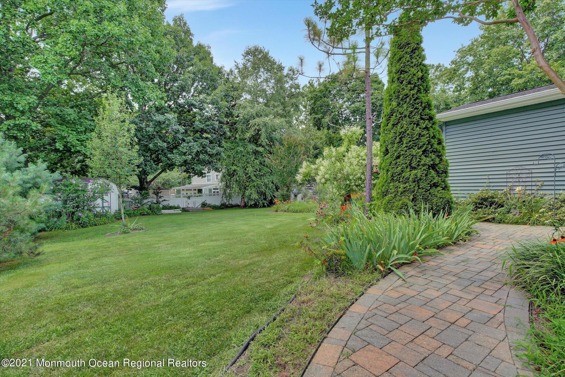 76 Swimming River Road Lincroft, NJ 07738 - Photo 49 of 50 a view of a yard with plants and a trees