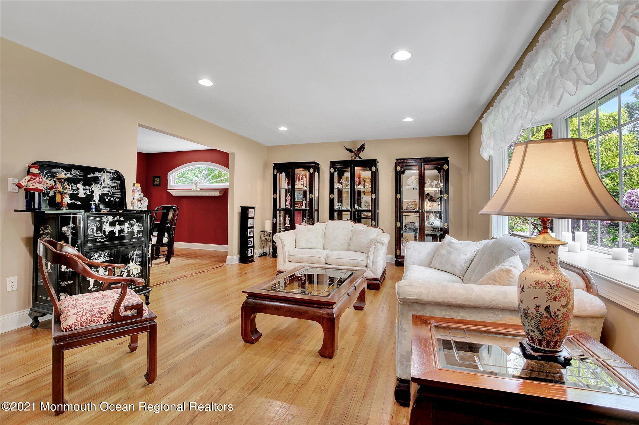 76 Swimming River Road Lincroft, NJ 07738 - Photo 9 of 50 a living room with furniture and a flat screen tv
