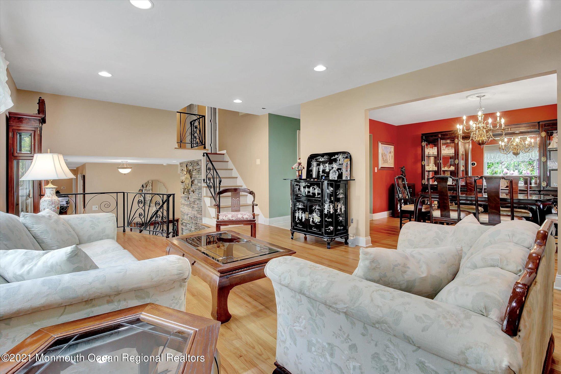 76 Swimming River Road Lincroft, NJ 07738 - Photo 10 of 50 a living room with furniture and a large window