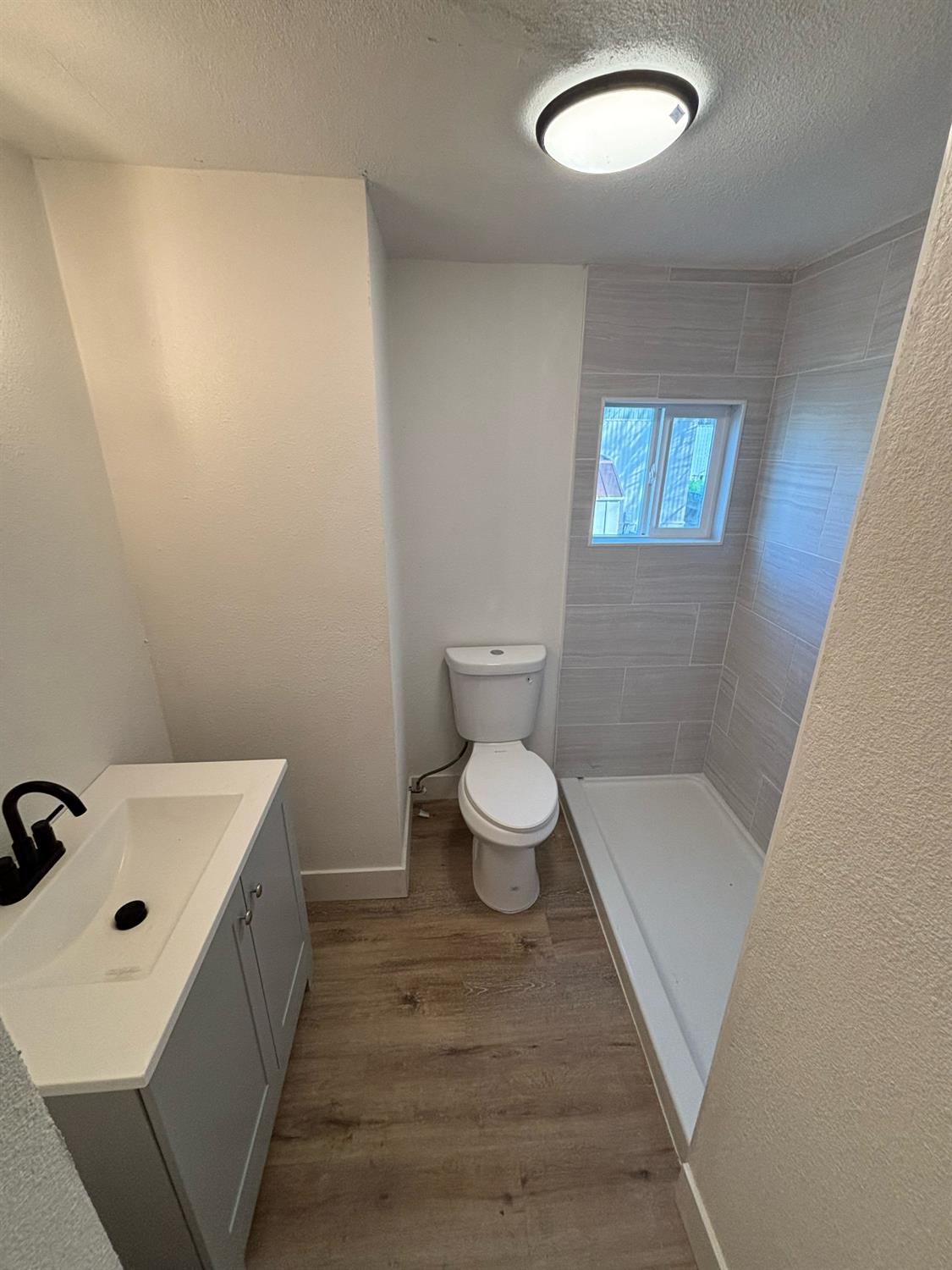 4449 South Carpenter Road, Unit B12 Modesto, CA 95358 - Photo 16 of 18 a bathroom with a sink and a toilet