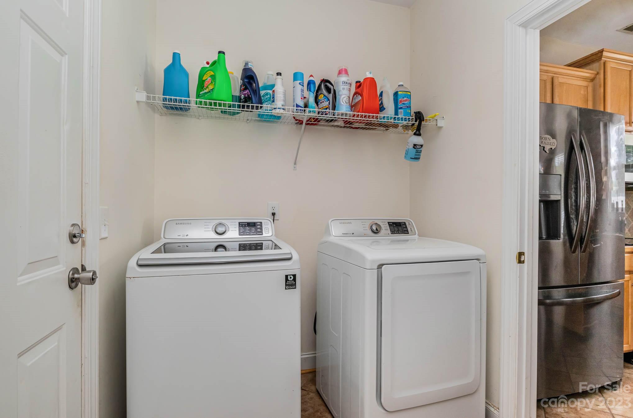 2719 Spring Breeze Way Monroe, NC 28110 - Photo 16 of 25 a utility room with dryer and washer