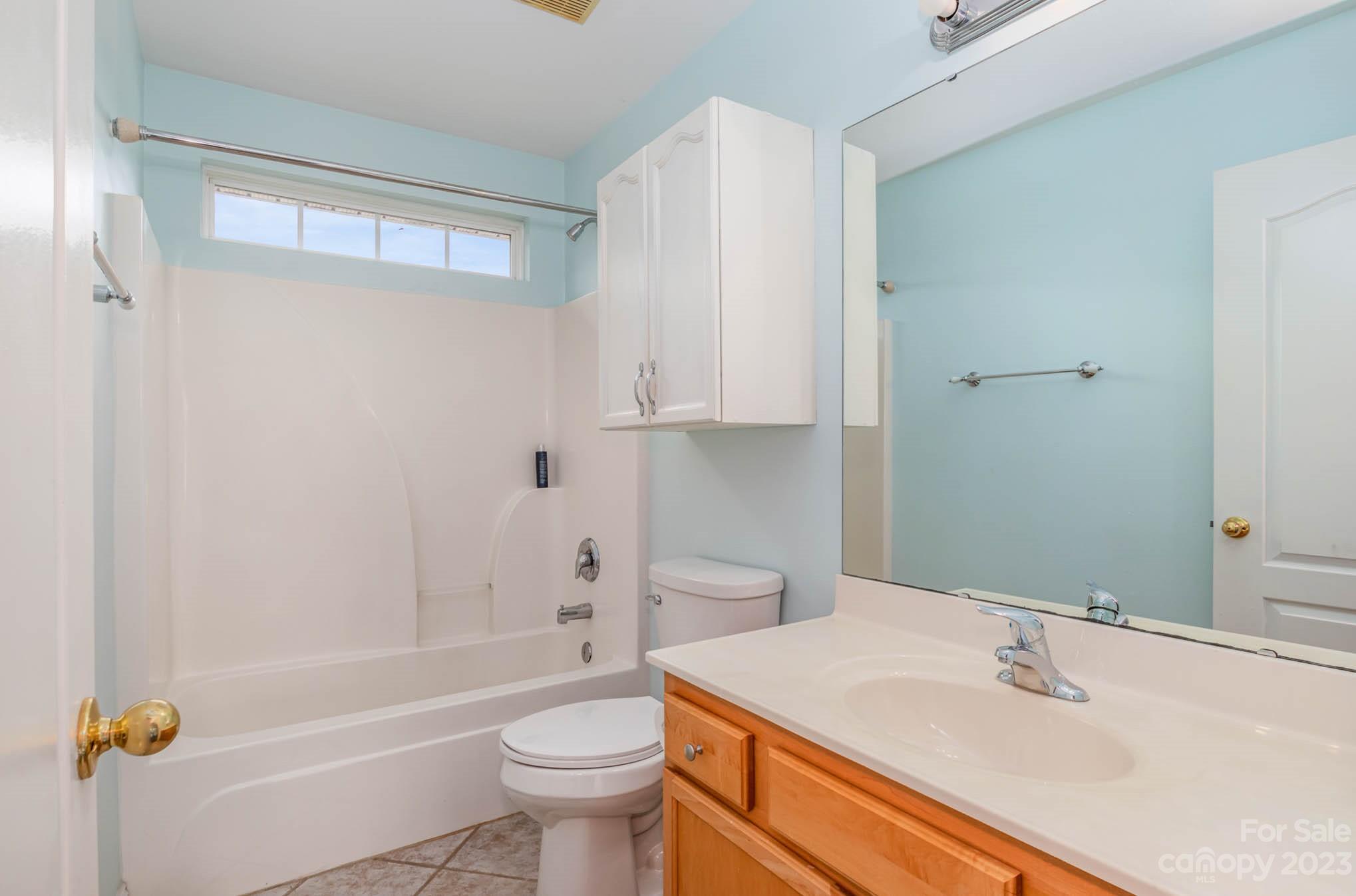 2719 Spring Breeze Way Monroe, NC 28110 - Photo 20 of 25 a bathroom with a sink a toilet and a bathtub