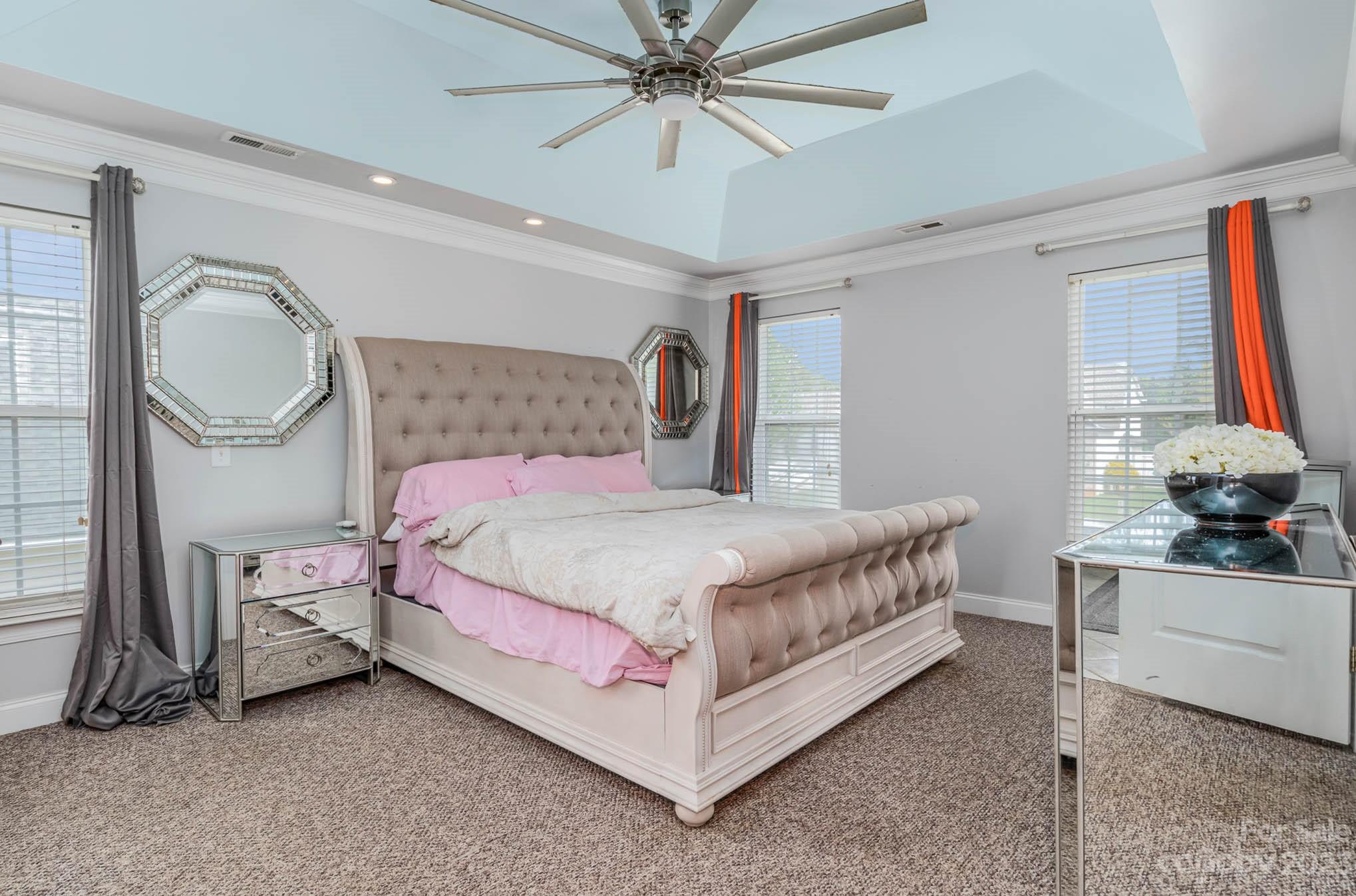 2719 Spring Breeze Way Monroe, NC 28110 - Photo 4 of 25 a bed room with a bed and a chandelier