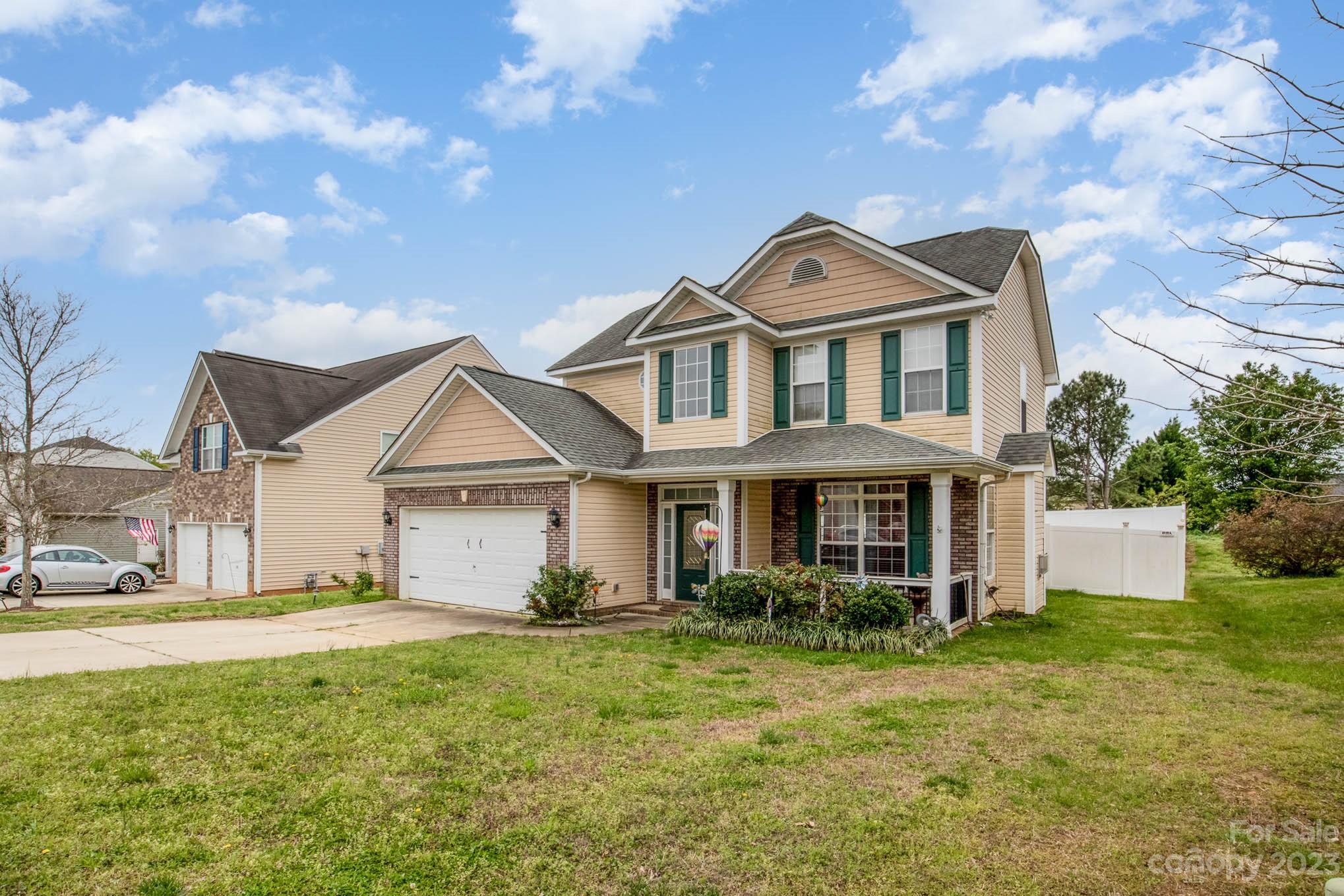 2719 Spring Breeze Way Monroe, NC 28110 - Photo 6 of 25 a front view of a house with a yard