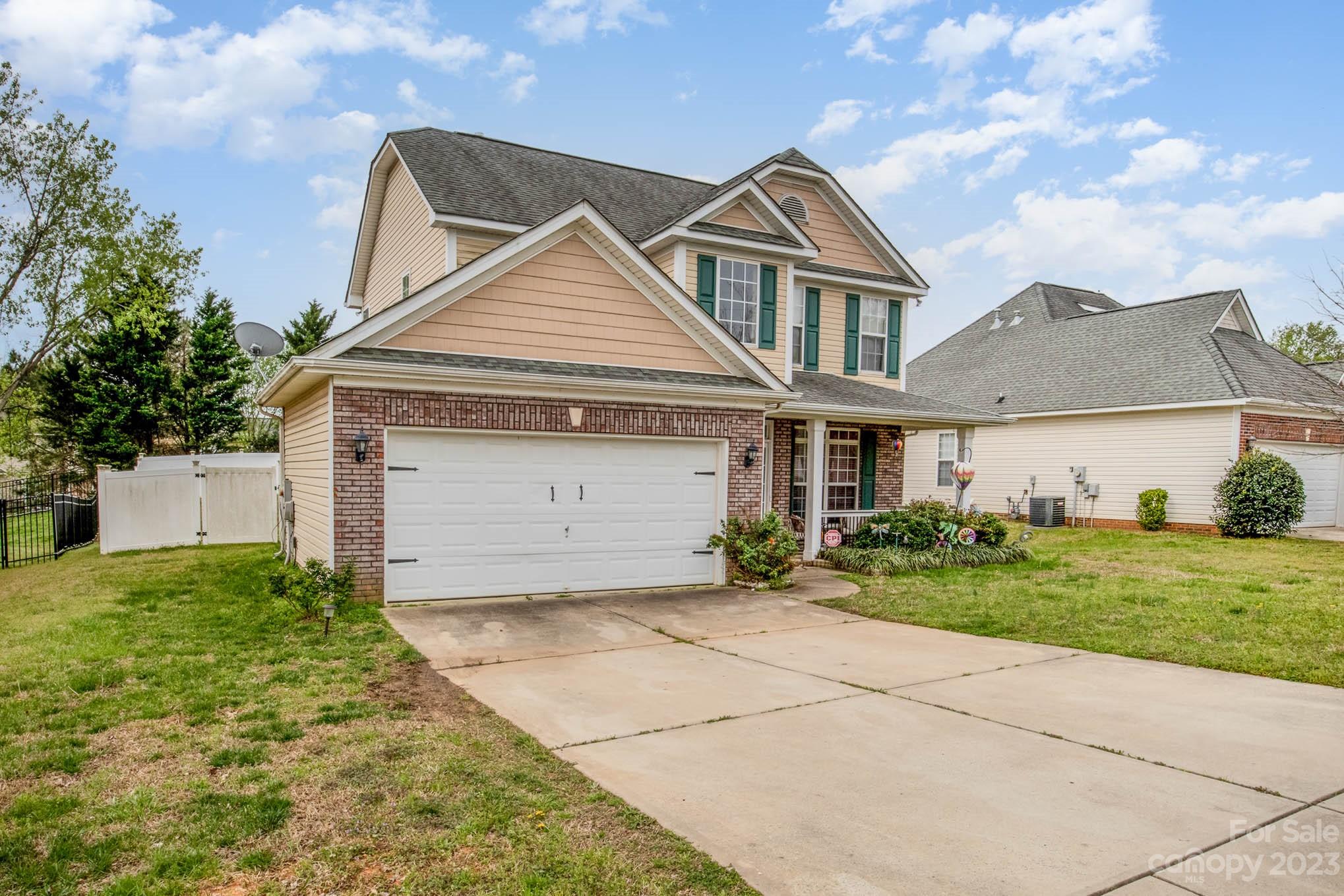 2719 Spring Breeze Way Monroe, NC 28110 - Photo 7 of 25 front view of a house with a yard