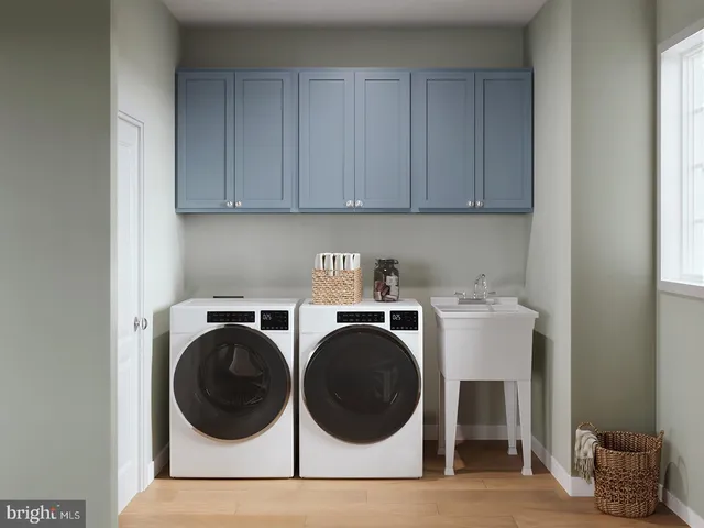 a view of a room with washer and dryer