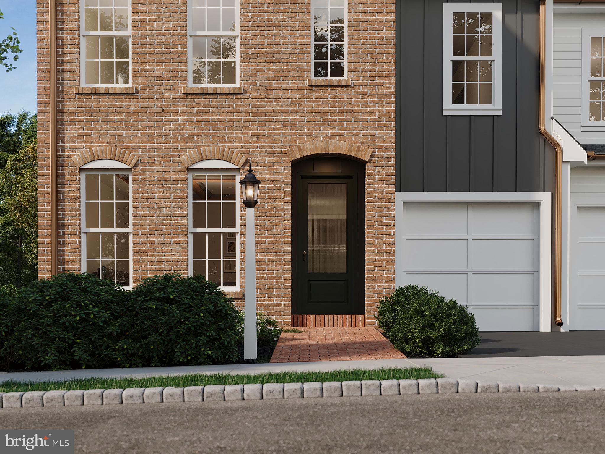 104 Merchant Avenue, Unit ARUNDEL Mount Joy, PA 17552 - Photo 17 of 38 a front view of a house with a yard and garage