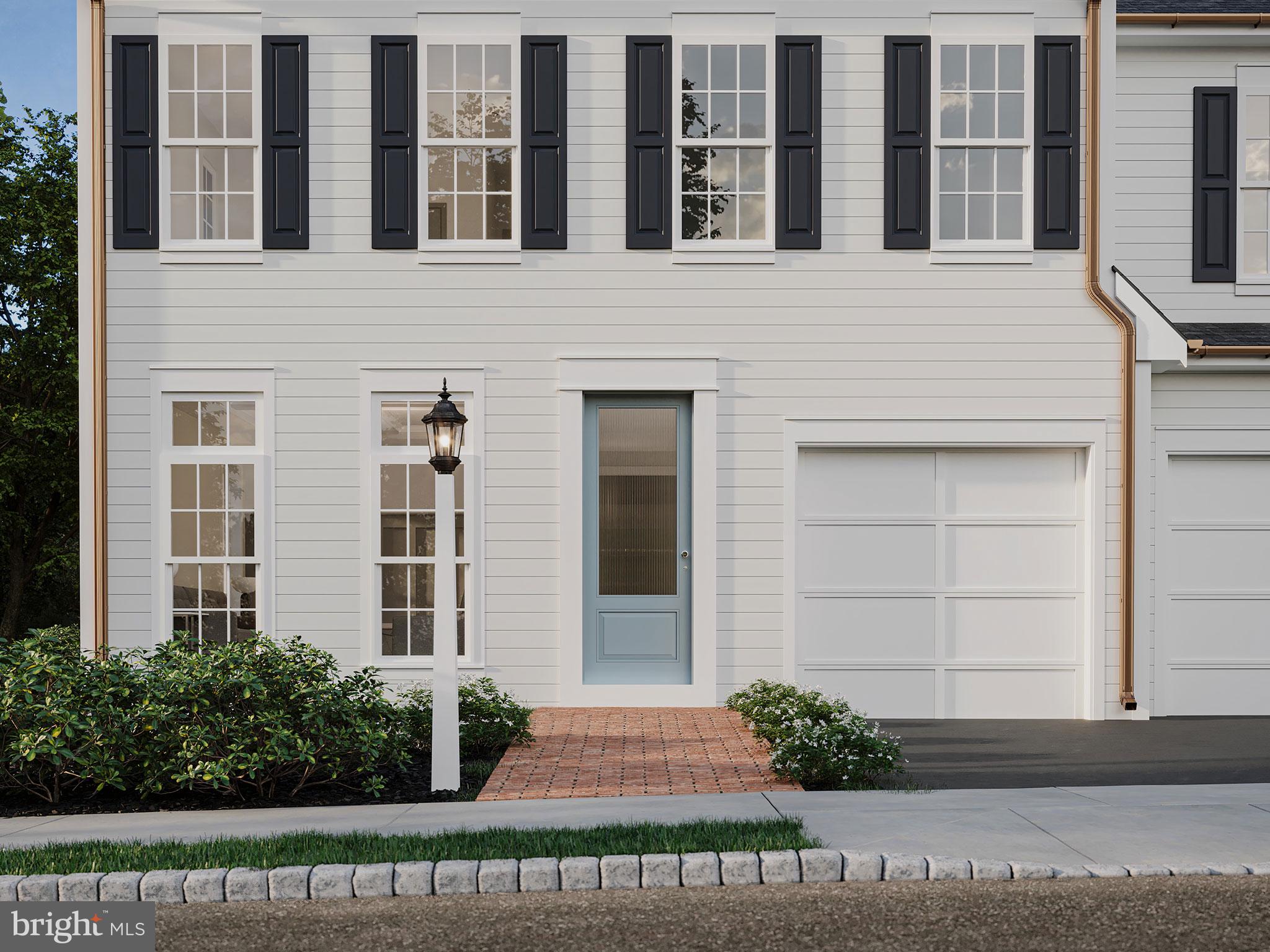 104 Merchant Avenue, Unit ARUNDEL Mount Joy, PA 17552 - Photo 21 of 38 a front view of a house with a garden