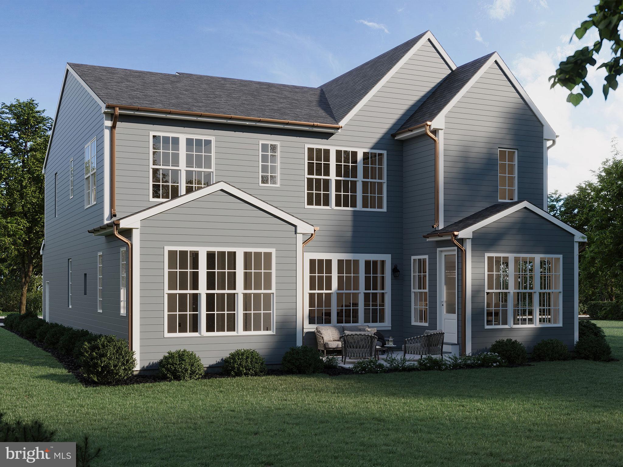 104 Merchant Avenue, Unit ARUNDEL Mount Joy, PA 17552 - Photo 26 of 38 a front view of a house with a yard