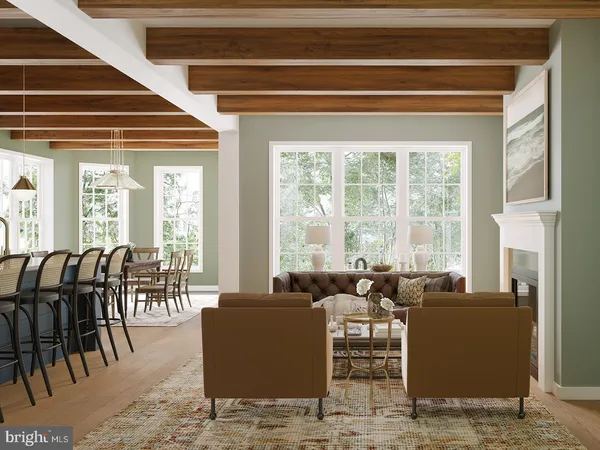 a living room with furniture and floor to ceiling windows