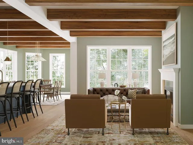 a living room with furniture and floor to ceiling windows
