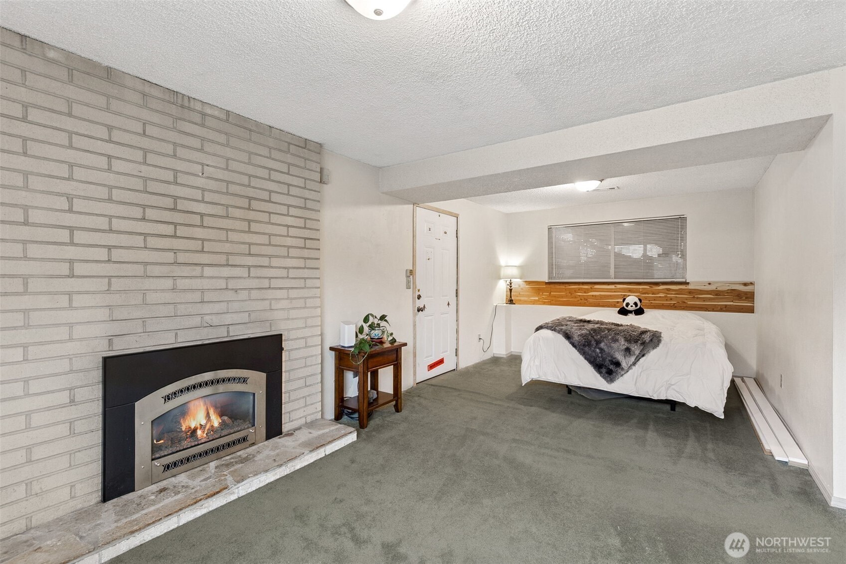 7825 Husky Way Southeast Olympia, WA 98503 - Photo 21 of 22 a living room with furniture and a fireplace