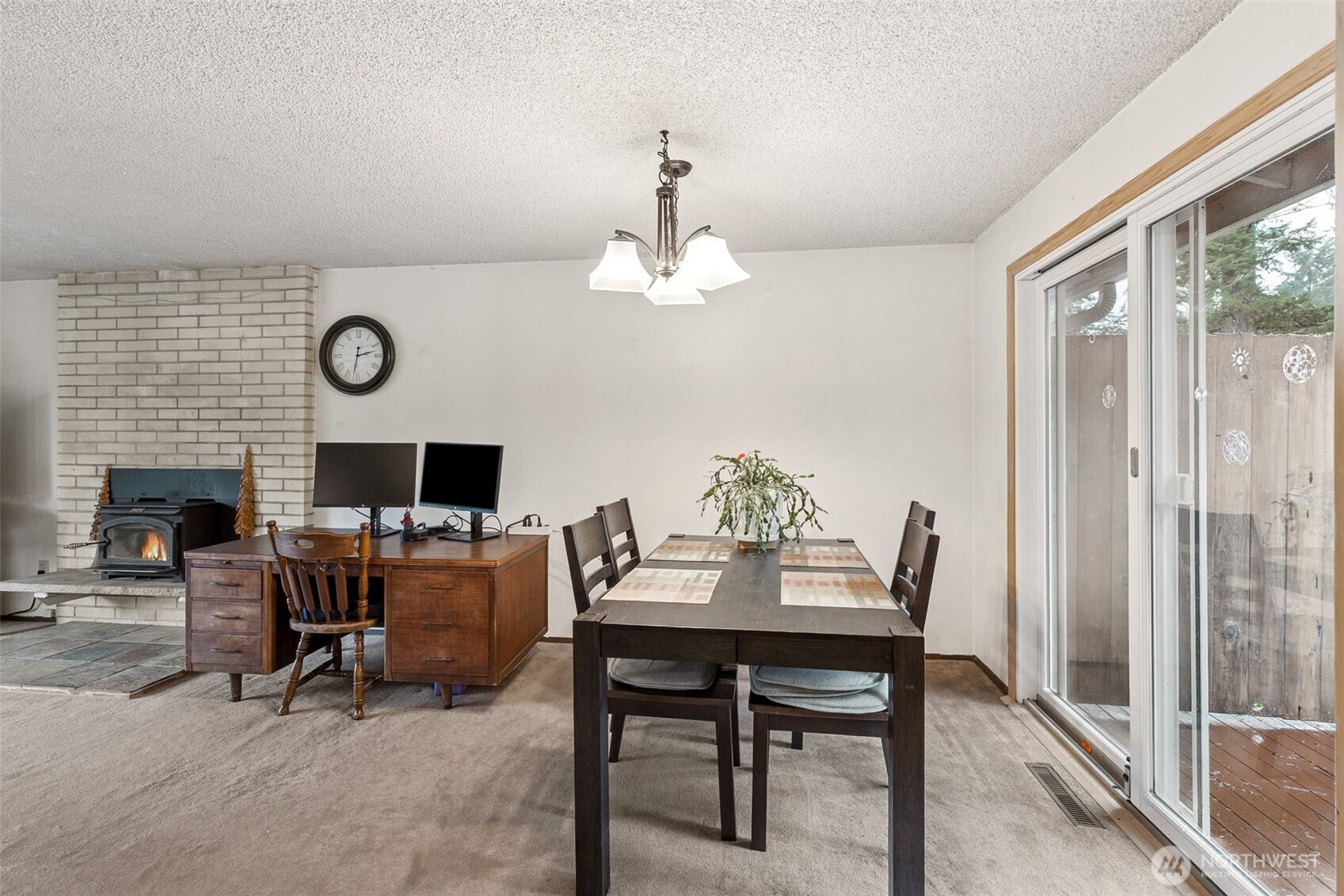 7825 Husky Way Southeast Olympia, WA 98503 - Photo 9 of 22 a view of a dining room with furniture window and wooden floor