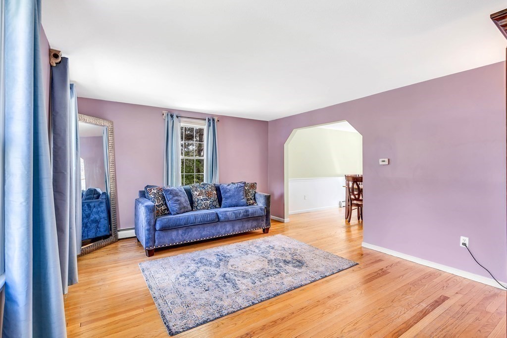 14 Puddingstone Lane Medway, MA 02053 - Photo 13 of 39 a living room with furniture and a wooden floor