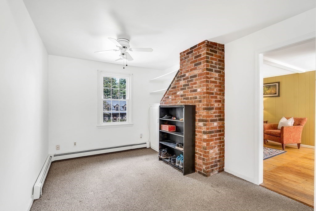 14 Puddingstone Lane Medway, MA 02053 - Photo 15 of 39 wooden floor in an empty room with a fireplace