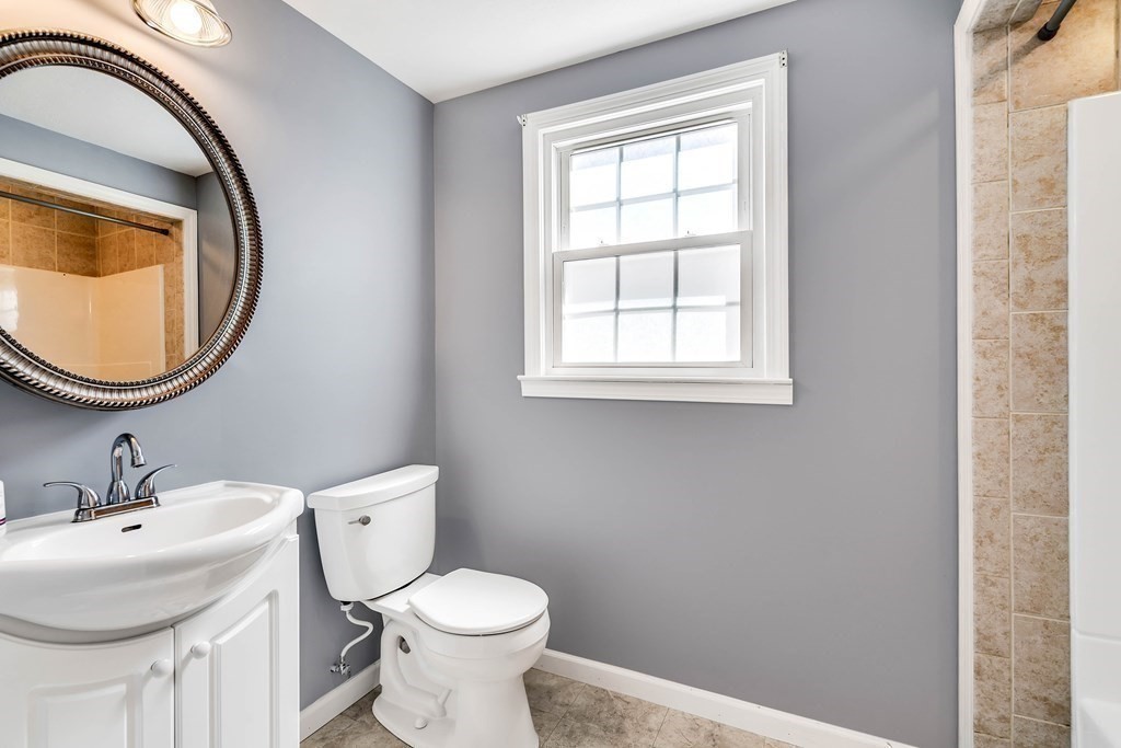 14 Puddingstone Lane Medway, MA 02053 - Photo 17 of 39 a bathroom with a sink a toilet and a mirror
