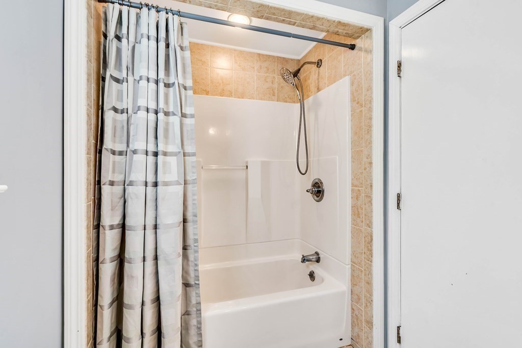 14 Puddingstone Lane Medway, MA 02053 - Photo 18 of 39 a bathroom with a shower and a tub