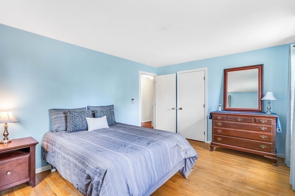 14 Puddingstone Lane Medway, MA 02053 - Photo 20 of 39 a bedroom with a bed and a mirror
