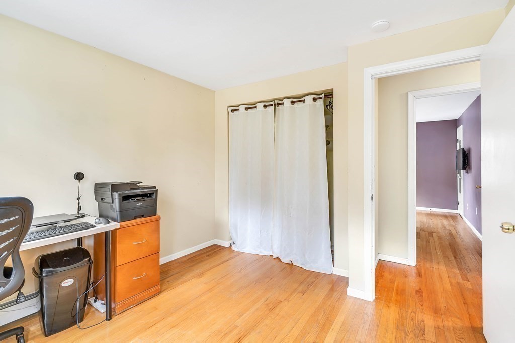14 Puddingstone Lane Medway, MA 02053 - Photo 25 of 39 a bedroom with a bed and wooden floor