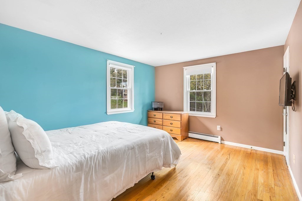14 Puddingstone Lane Medway, MA 02053 - Photo 26 of 39 a spacious bedroom with a bed and wooden floor