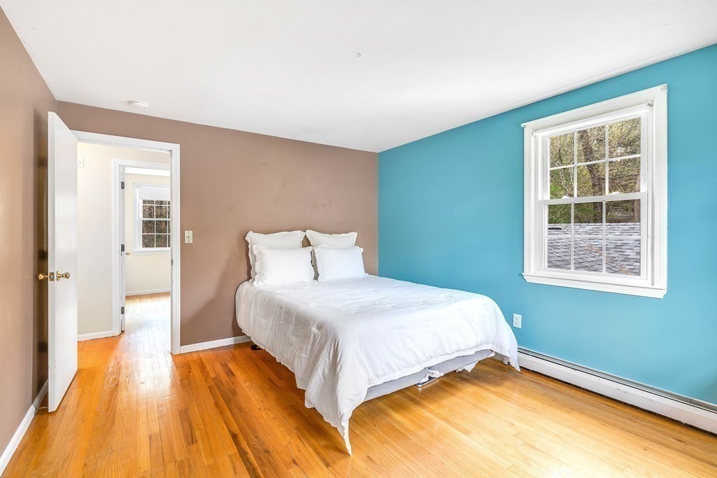 14 Puddingstone Lane Medway, MA 02053 - Photo 27 of 39 a bedroom with a bed and lamps