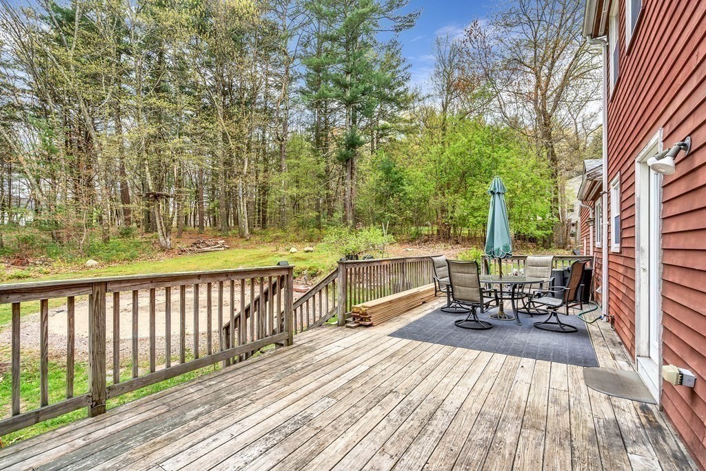 14 Puddingstone Lane Medway, MA 02053 - Photo 32 of 39 a view of balcony with wooden floor and outdoor seating