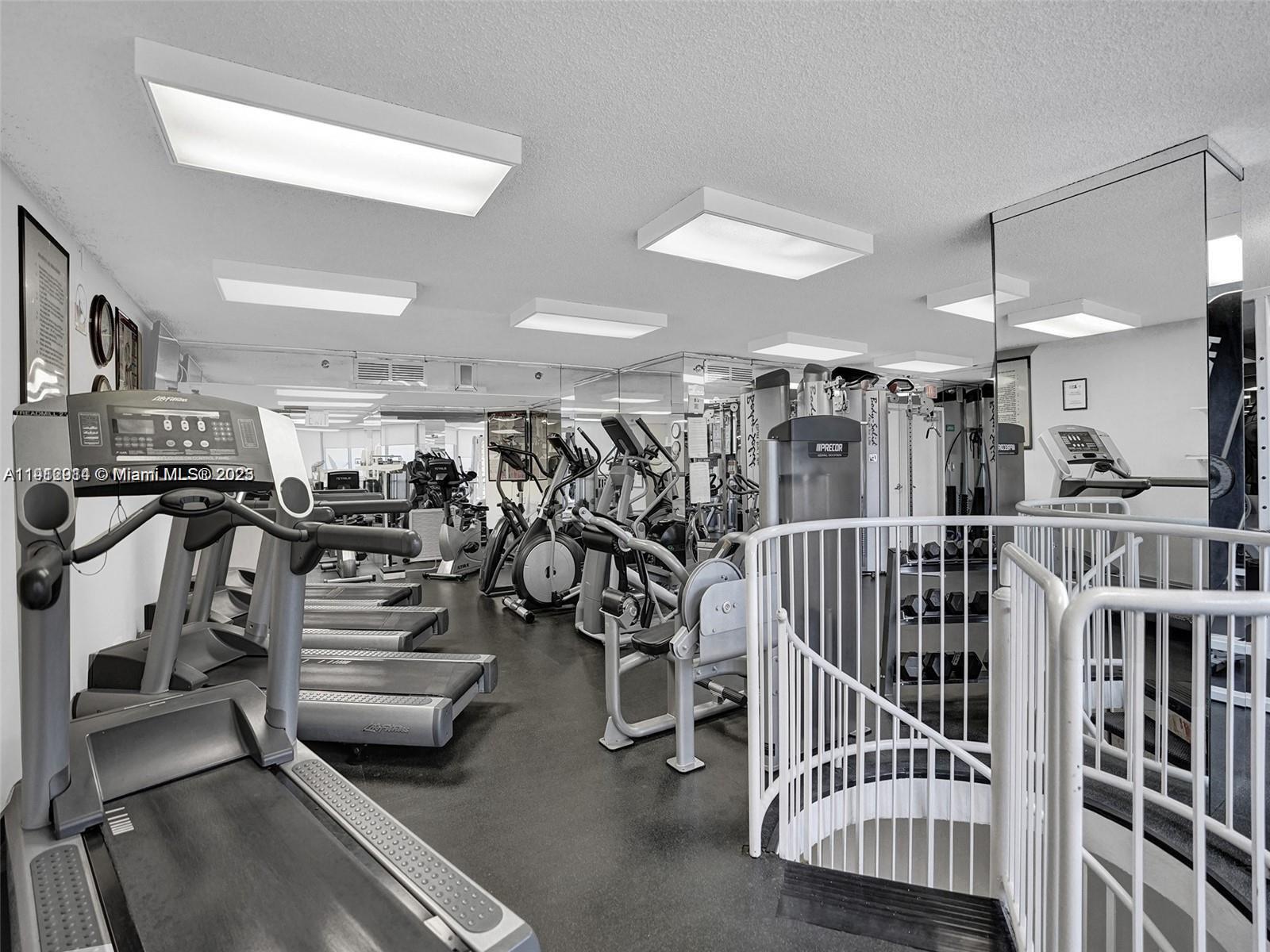 3530 Mystic Pointe Drive, Unit 1708 Aventura, FL 33180 - Photo 24 of 27 a view of a room with gym equipment