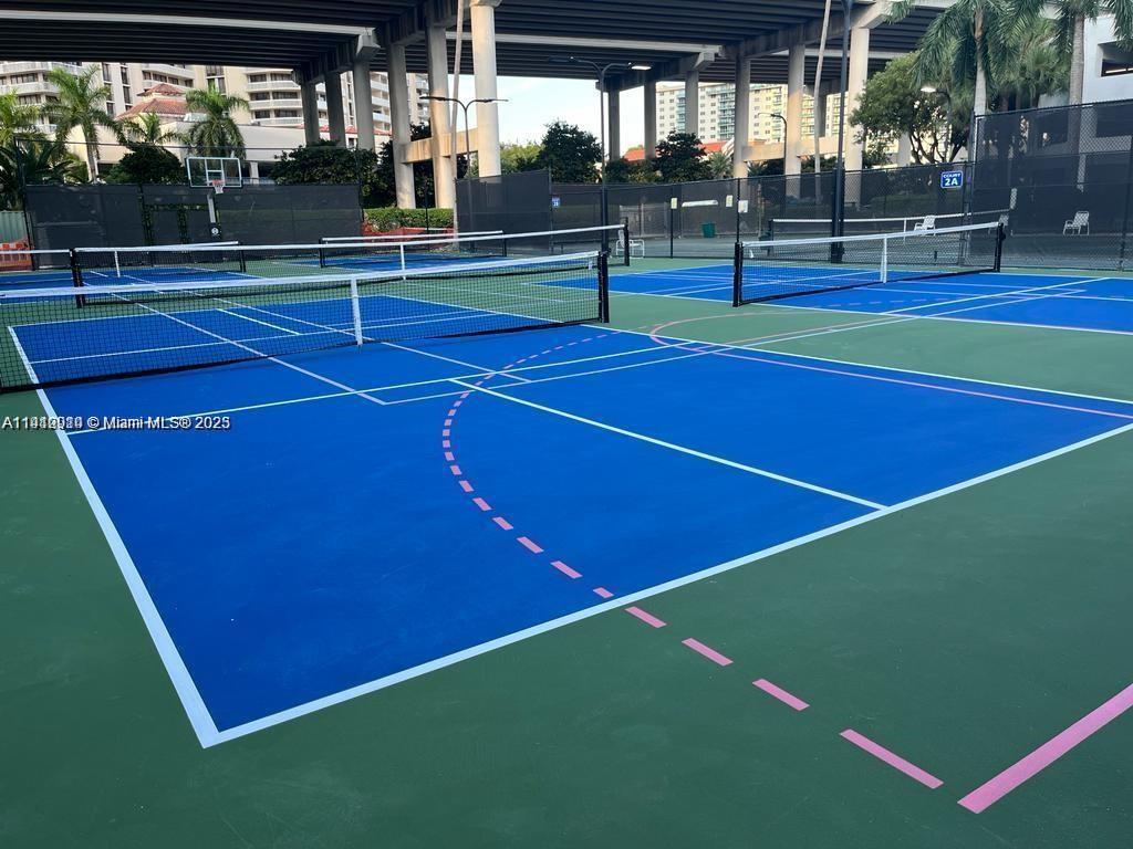 3530 Mystic Pointe Drive, Unit 1708 Aventura, FL 33180 - Photo 27 of 27 a view of an outdoor space and tennis court