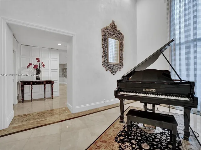 a living room with furniture and a rug
