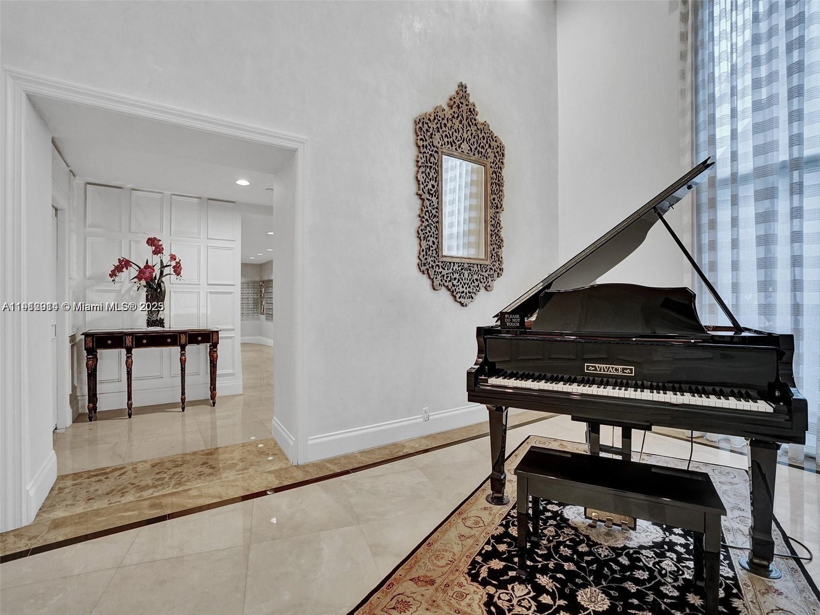 3530 Mystic Pointe Drive, Unit 1708 Aventura, FL 33180 - Photo 3 of 27 a living room with furniture and a rug