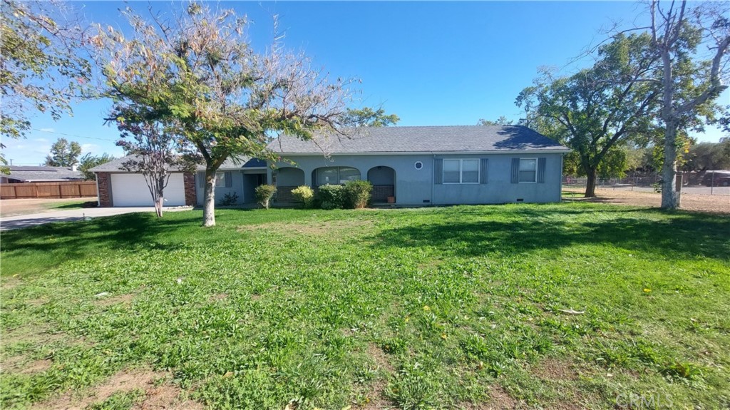 533 Edith Avenue Corning, CA 96021 - Photo 1 of 1 a view of a yard in front of a house with large tree