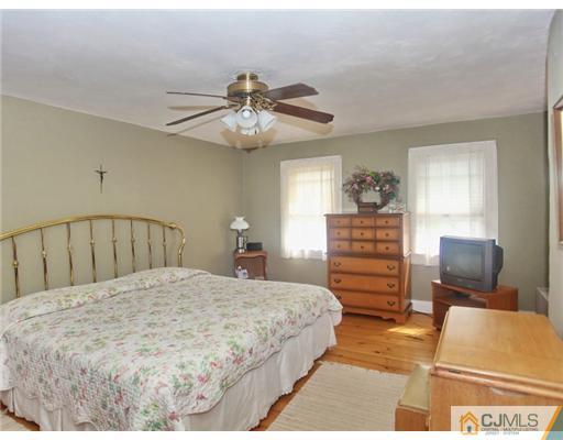 88 Halsey Reed Road Cranbury, NJ 08512 - Photo 12 of 18 a bedroom with a bed and dresser