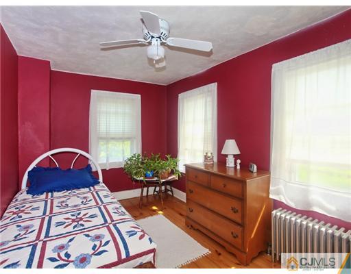 88 Halsey Reed Road Cranbury, NJ 08512 - Photo 15 of 18 a living room with furniture and a chandelier
