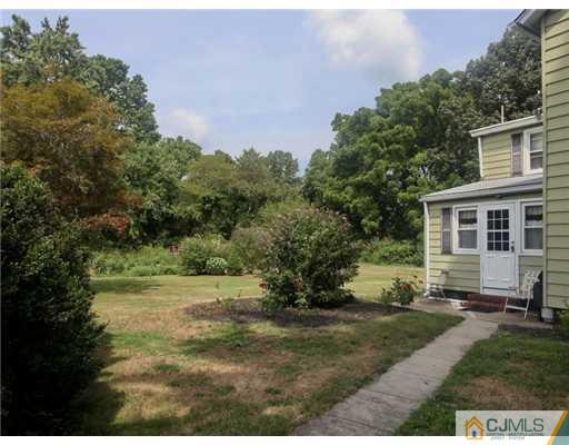 88 Halsey Reed Road Cranbury, NJ 08512 - Photo 17 of 18 a view of a backyard with large trees
