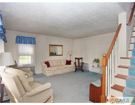 88 Halsey Reed Road Cranbury, NJ 08512 - Photo 3 of 18 a living room with furniture and a wooden floor