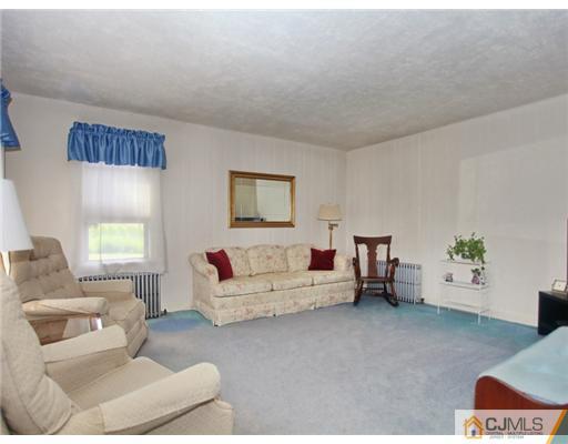 88 Halsey Reed Road Cranbury, NJ 08512 - Photo 4 of 18 a living room with furniture and a couch