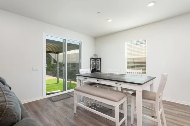 a view of a kitchen with a sink and a large window