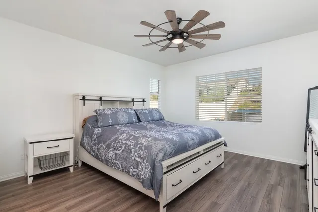 a bed room with a bed and a chandelier