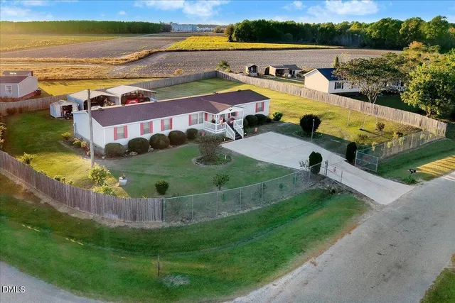 an aerial view of a house with swimming pool