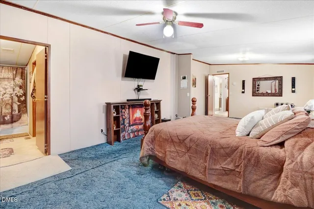 a bed room with a bed and a night stand