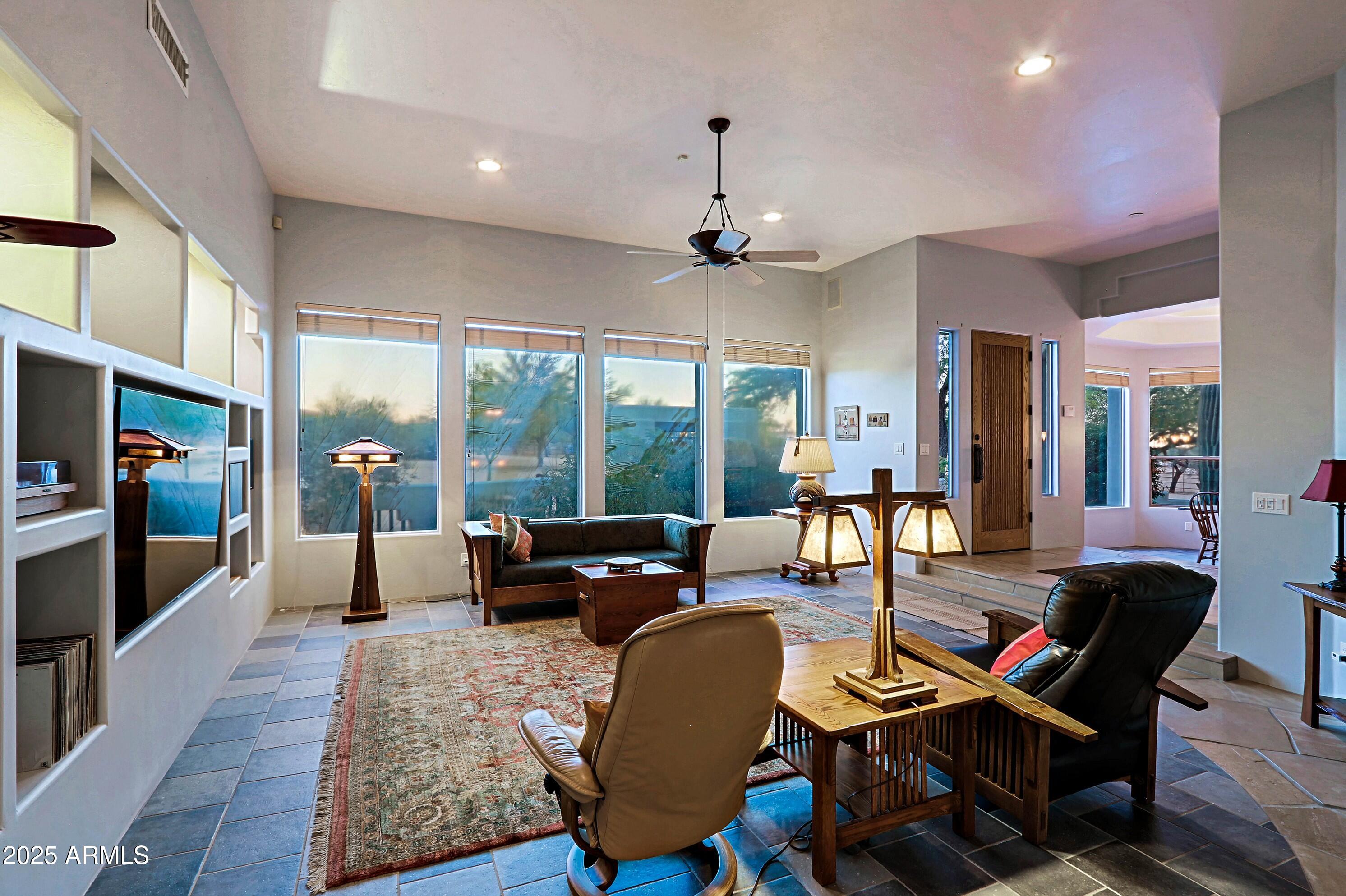 41840 North Spur Cross Road Cave Creek, AZ 85331 - Photo 14 of 67 a dining room with furniture a chandelier and wooden floor